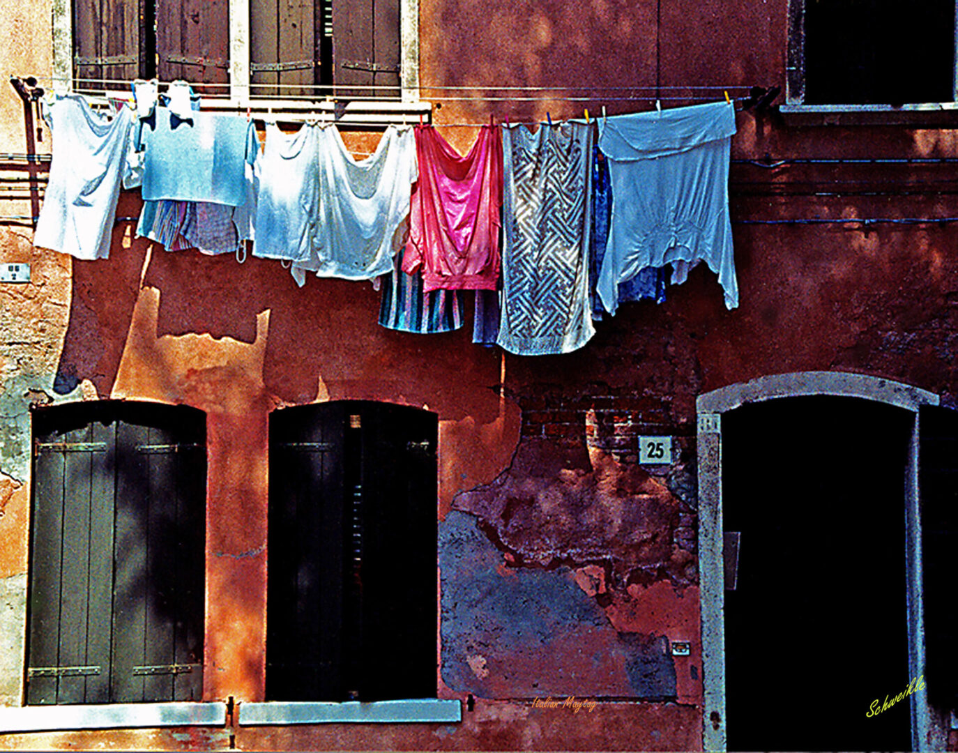 A building with clothes hanging on the line.